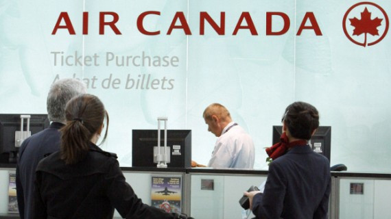 Air Canada passengers wait to purchase tickets at Toronto's Pearson airport in 2008. - Air Canada passengers wait to purchase tickets at Toronto's Pearson airport in 2008. | Mike Cassese/Reuters