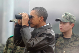 奥巴马到访三八线 用望远镜眺望朝鲜