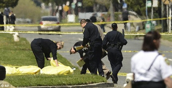 Oakland Police cover the bodies of victims of the shooting massacre at Oikos University