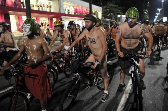Naked cyclists ride their bikes along the Paulista Avenue during the 5th Pedalada Pelada;a naked bike ride to protest against cars;gas emission and agressive drivers;on March 10;2012 in Sao Paulo;Brazil.