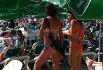 劲：以色列女兵荷枪穿比基尼现沙滩