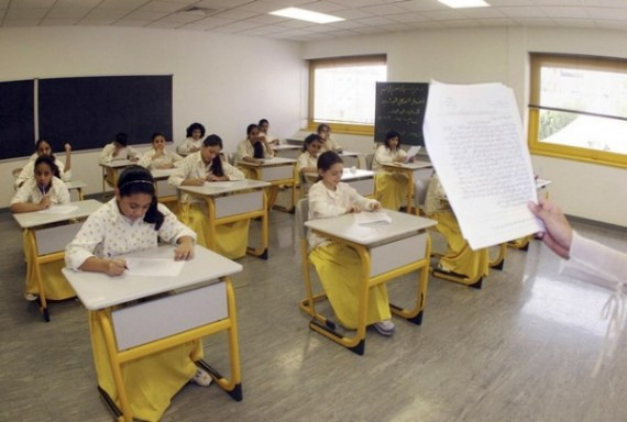Saudi elementary students from Children's World School sit for an exam in Jeddah