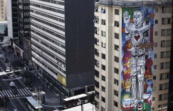 Brazilian graffiti artist Amaral puts the final touches to his piece of work entitled 