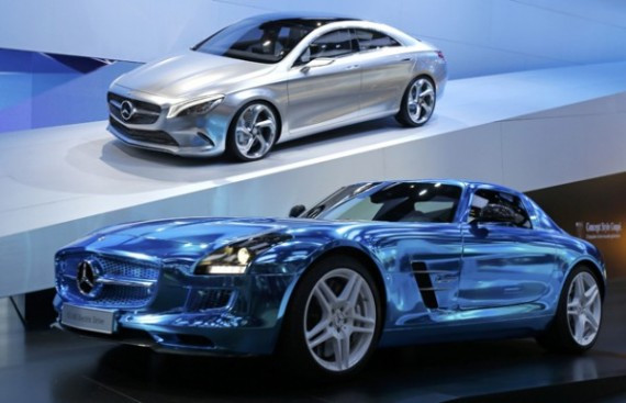 A Mercedes-Benz Concept Style Coupe model and a Mercedes-Benz SLS AMG Electric Drive model are  displayed on media day at the Paris Mondial de l'Automobile