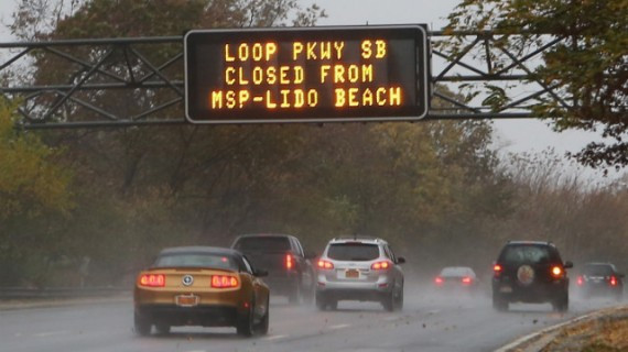 An overhead sign on the Southern Parkway alerts motorists to road closings in Wantagh, New York, on Monday.