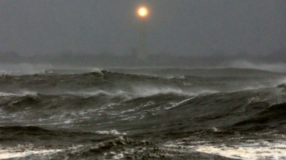 Cape May Lighthouse shines over the heavy surf. 