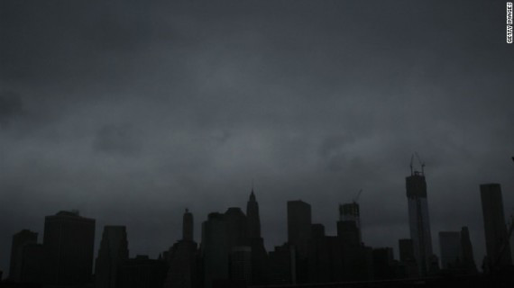 Dark clouds cover the skyline of Manhattan early Monday.