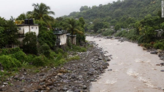 Houses sit along the Hope River in Kingston on Wednesday.