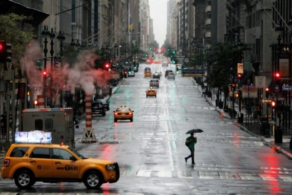 a-pedestrian-crosses-madison-avenue-as-new-york-waits-on-hurricane-irene