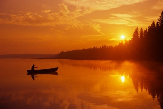 Canoeing at Sunrise on Child's Lake in Canada