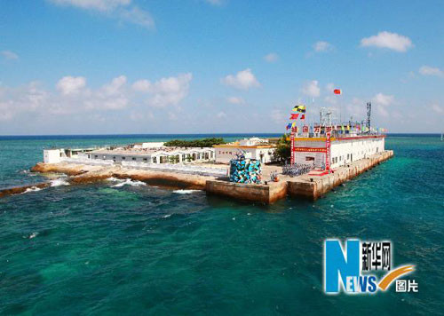 永暑礁建站始末：上千吨水泥全靠官兵一包包扛下来(组图)
