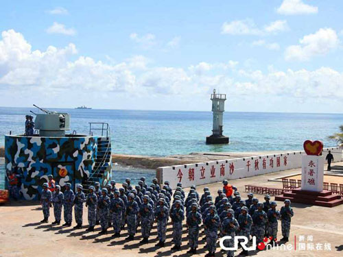 永暑礁建站始末：上千吨水泥全靠官兵一包包扛下来(组图)