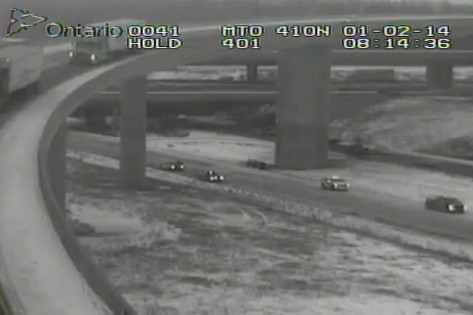 Ontario Provincial Police investigate a fatal crash on Highway 403 near Highway 410 on Jan. 2, 2014. EYES TORONTO.