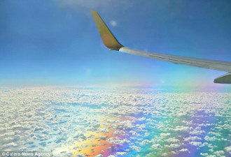 美呆了 加国女士飞机上拍到云下彩虹
