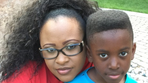 LaSania Hamilton with her eight-year old son Jair. The single mother has a master's degree and a paralegal diploma. But she says she's underemployed and barely makes a living wage.