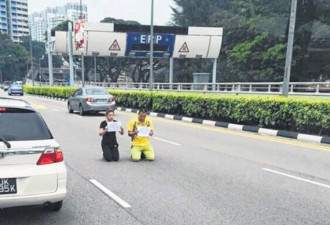 中国夫妻在新加坡讨薪 跪地请愿反被捕