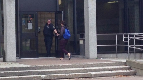 A security guard at Dalhousie's Sir Charles Tupper medical building opens the door for a student requiring access last week.