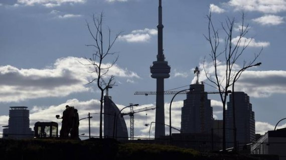 The CN Tower (centre) is framed by small saplings and condo developments as seen from the West Don Lands near Bayview Ave and Eastern Ave. on Oct 30 2015. (Fred Lum/The Globe and Mail)