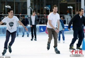 美东部反常高温 纽约民众穿短袖溜冰