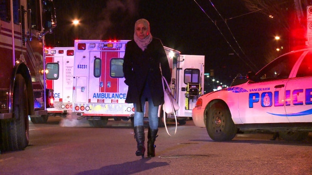A woman leaves the Muslim Association of Canada centre on Kingsway after a large group of Syrian refugees were attacked with pepper spray.