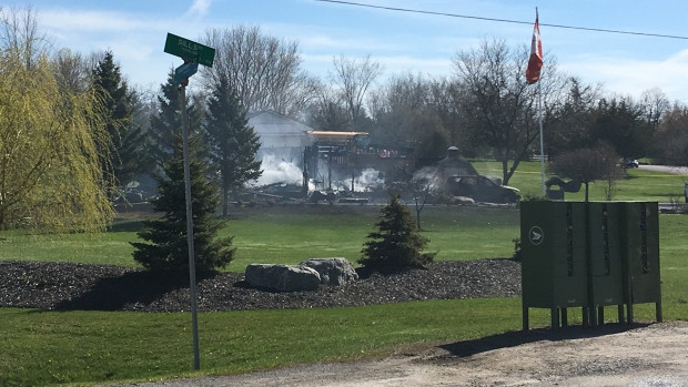 About 30 firefighters were at a Belleville, Ont., property on Friday morning to battle fire involving two structures. Police found one body at the scene.