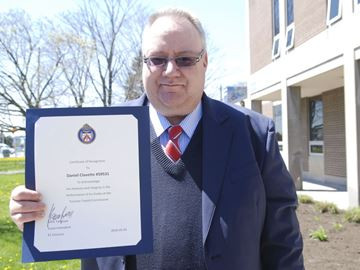 Toronto bus driver honoured for returning $50,000 in cash found in knapsack on TTC bus