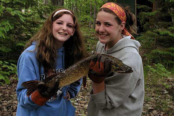 photo of researcher holding fish