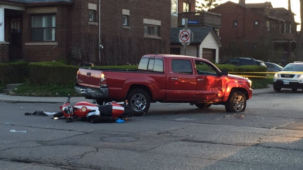 A man believed to be in his 40s has been rushed to hospital after a collision with a pickup truck while riding a motorcycle.