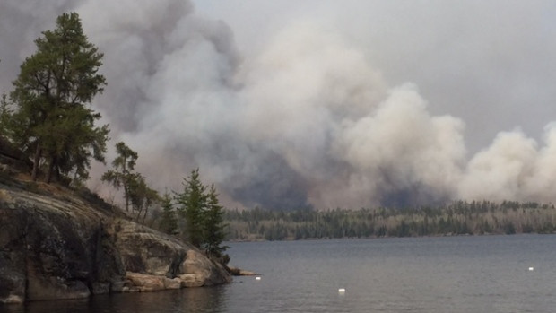The view of a wildfire near Caddy Lake on Monday afternoon. The fire is expected to continue growing due to dry and windy conditions, say Ontario fire officials.