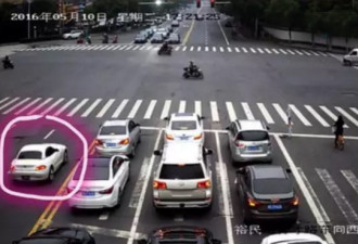 18岁留学生开宝马逆行闯红灯 拖行交警30多米