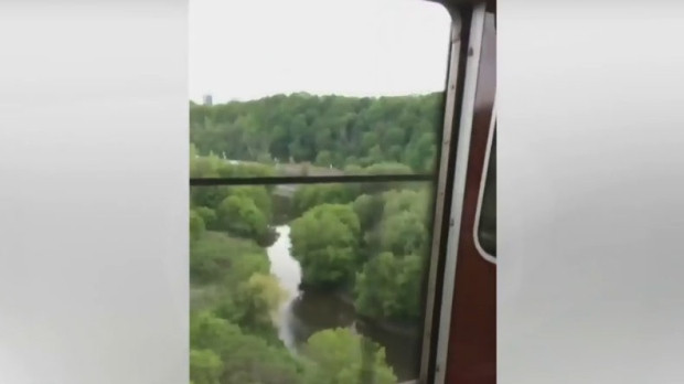 The TTC is investigating after doors opened on a moving subway train over the Bloor Viaduct last night. 