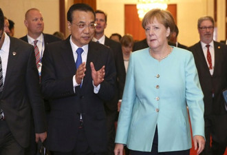 手握两砝码 默克尔碰触北京两敏感议题
