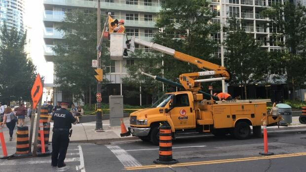 John Street was closed south of Wellington for a time Tuesday evening when high winds threatened to topple streetlights.