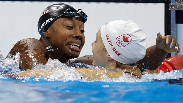 Canada's Penny Oleksiak (right) and American Simone Manuel celebrate after tying for the gold medal in the women's 100-metre freestyle at the 2016 Summer Olympics.