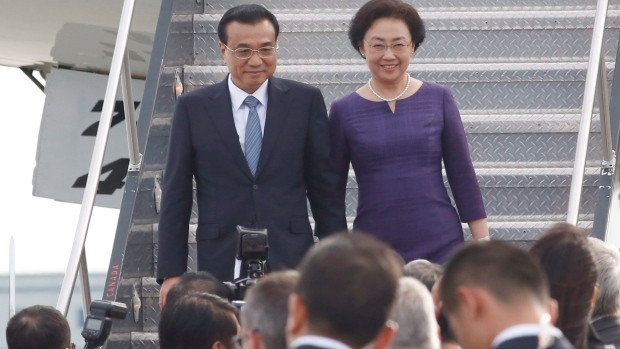 Chinese Premier Li Keqiang and his wife Cheng Hong arrive at the Ottawa airport to begin a four-day Canadian visit on Wednesday, September 21, 2016.