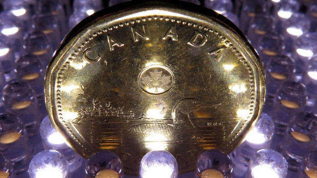 Disappointing economic data on Friday and a suggestion of a possible rate cut by the Bank of Canada have pushed the loonie lower.