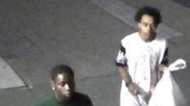 Police are seeking the public's help in locating the two men shown in this security camera image.