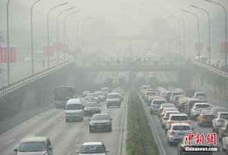 北京发布雾霾橙色预警 能见度低建筑物隐身