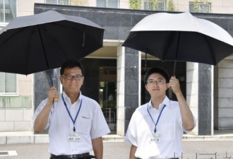 天太热，日本“阳伞男”越来越多