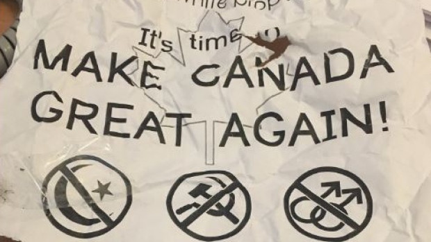 The posters include links to white supremacist websites.