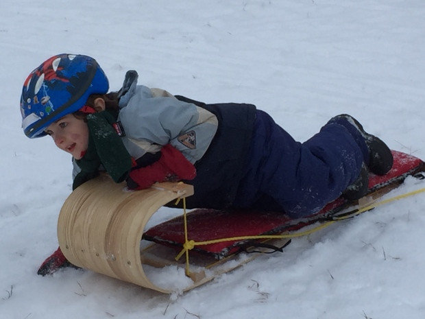 Regina - boy - toboggan - snow - Christmas