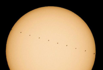 NASA发空间站从太阳前方穿过的剪影:令人惊叹