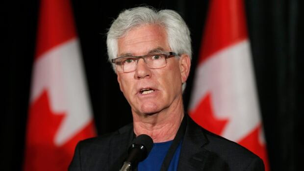 Minister of Natural Resources James Carr answers questions from the media at a Liberal cabinet retreat in Calgary. Carr said he has heard no talk of the Trump administration imposing a border tax on Canada's energy exports.
