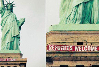 美国自由女神像被挂“欢迎难民”横幅
