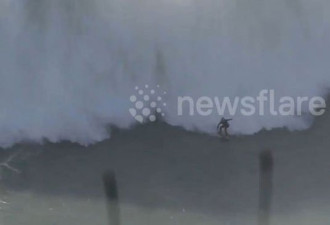 澳冲浪者挑战18米高巨浪 身体失控被吞噬