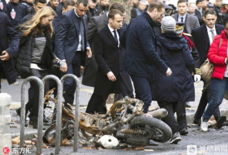马克龙走访巴黎示威后街道 宣布暂停上调燃油税
