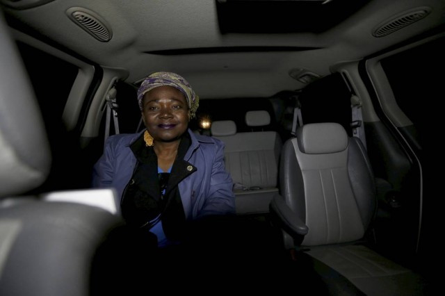 A Haitian woman, who gave her name as Cilotte, is driven by taxi driver Curtis Seymour of C&L Taxi, to the U.S.- Canada border in Champlain, New York