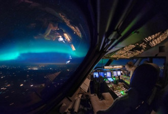 飞行员驾驶舱拍夜空美景:微弱北极光伴随日出