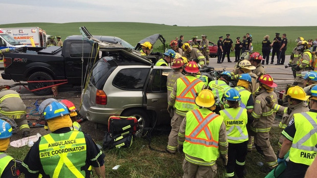 Firefighters assist victims of a two-vehicle crash in New Tecumseth on June 17, 2017. (Peel Paramedics)