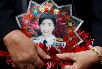 泰国前美女总理英拉出庭受审大变样